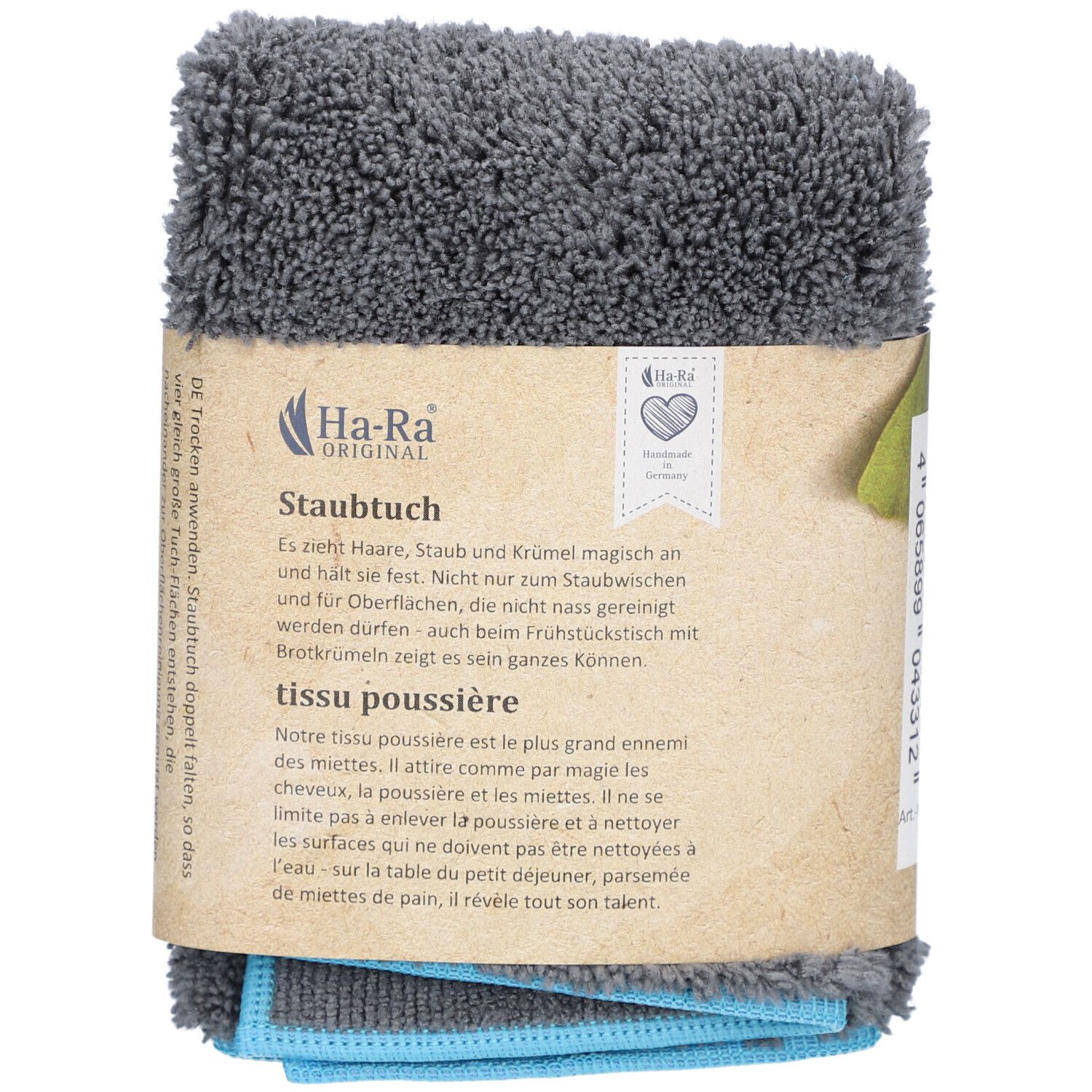 Grijs HA-RA stofdoek, opgevouwen en verpakt. Bruine kartonnen banderol met logo en tekst. Blauwe en grijze doeken zichtbaar.
