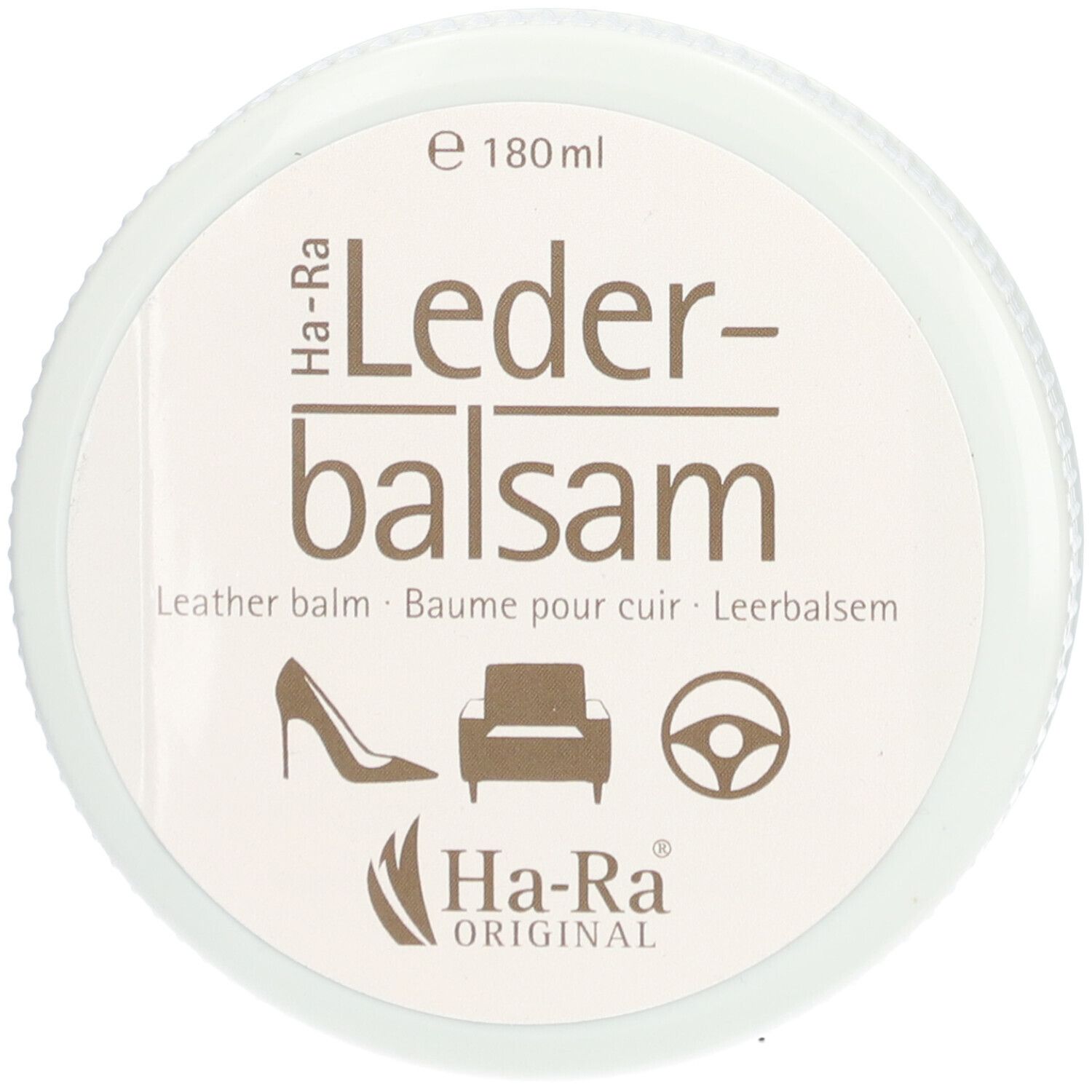 Pot rond blanc avec inscription Lederbalsam. Logos d'une chaussure, d'un fauteuil et d'un volant. Marque Ha-Ra Original.