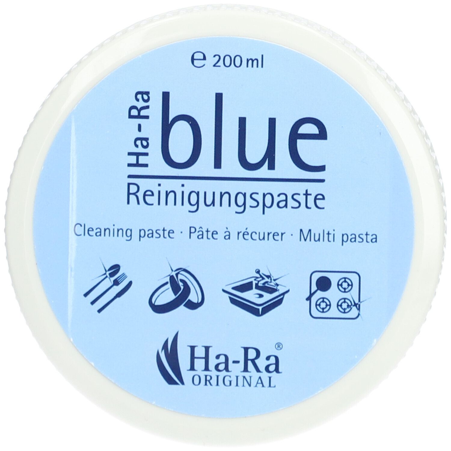 Ronde pot met blauw deksel. Opschrift: Ha-Ra blue Reinigungspaste. Logo's en pictogrammen.