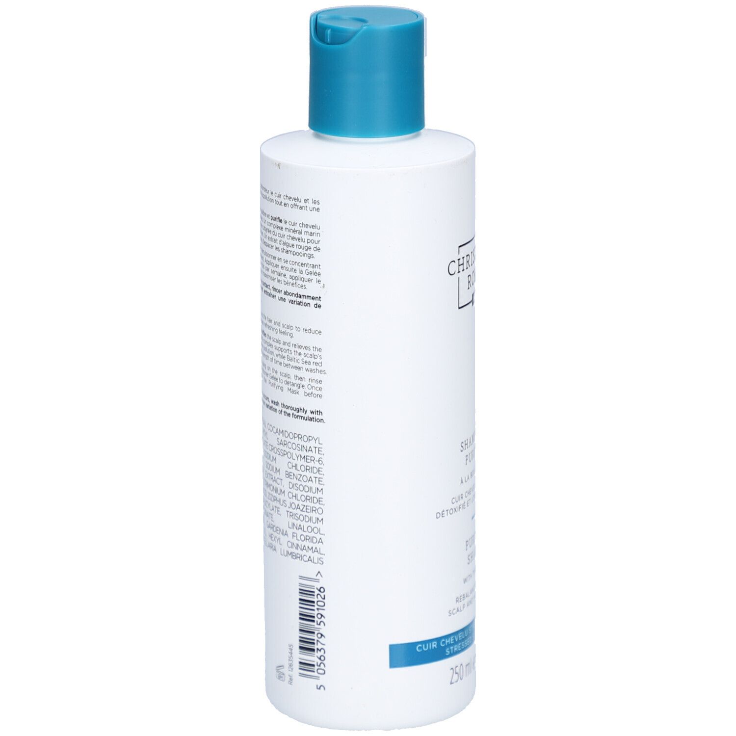Achterkant van de witte fles met blauwe dop. Meertalige tekst. Ingrediënten en instructies.
