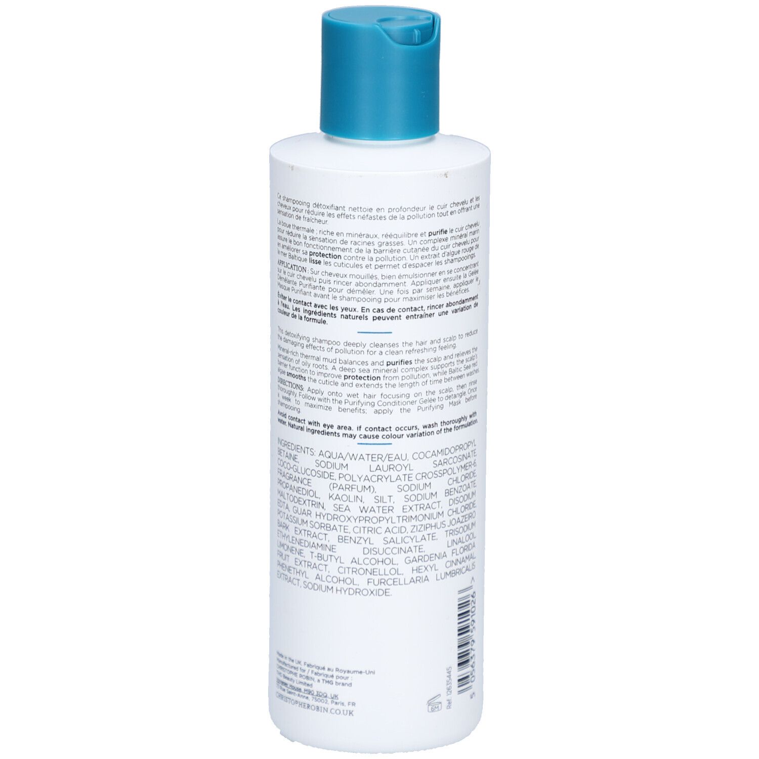 Achterkant van de witte fles met blauwe dop. Meertalige tekst. Ingrediënten en instructies.