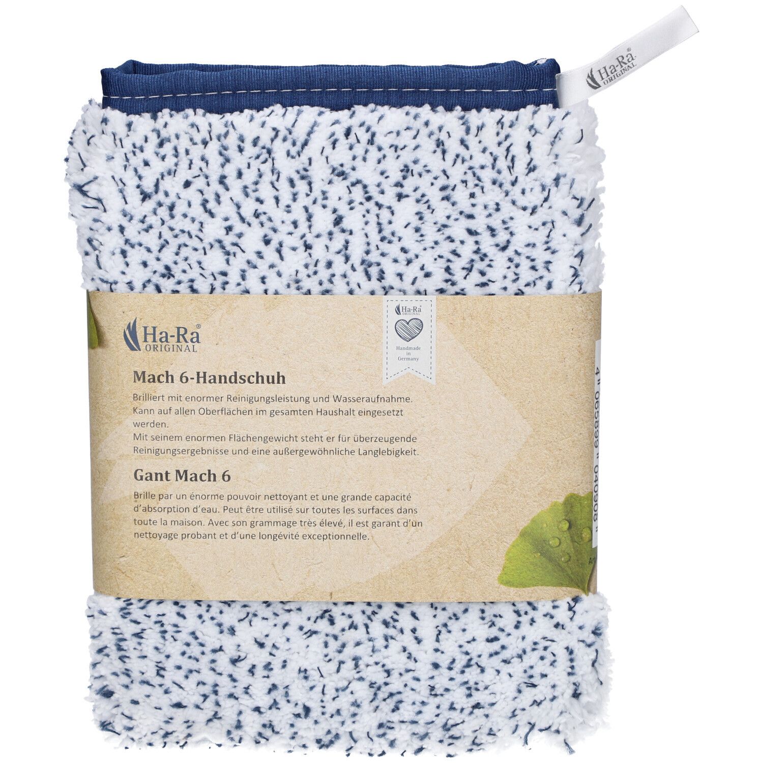 Verpakte schoonmaakhandschoenen. Wit met blauwe stippen, blauwe zoom. Papieren band met productnaam en logo.