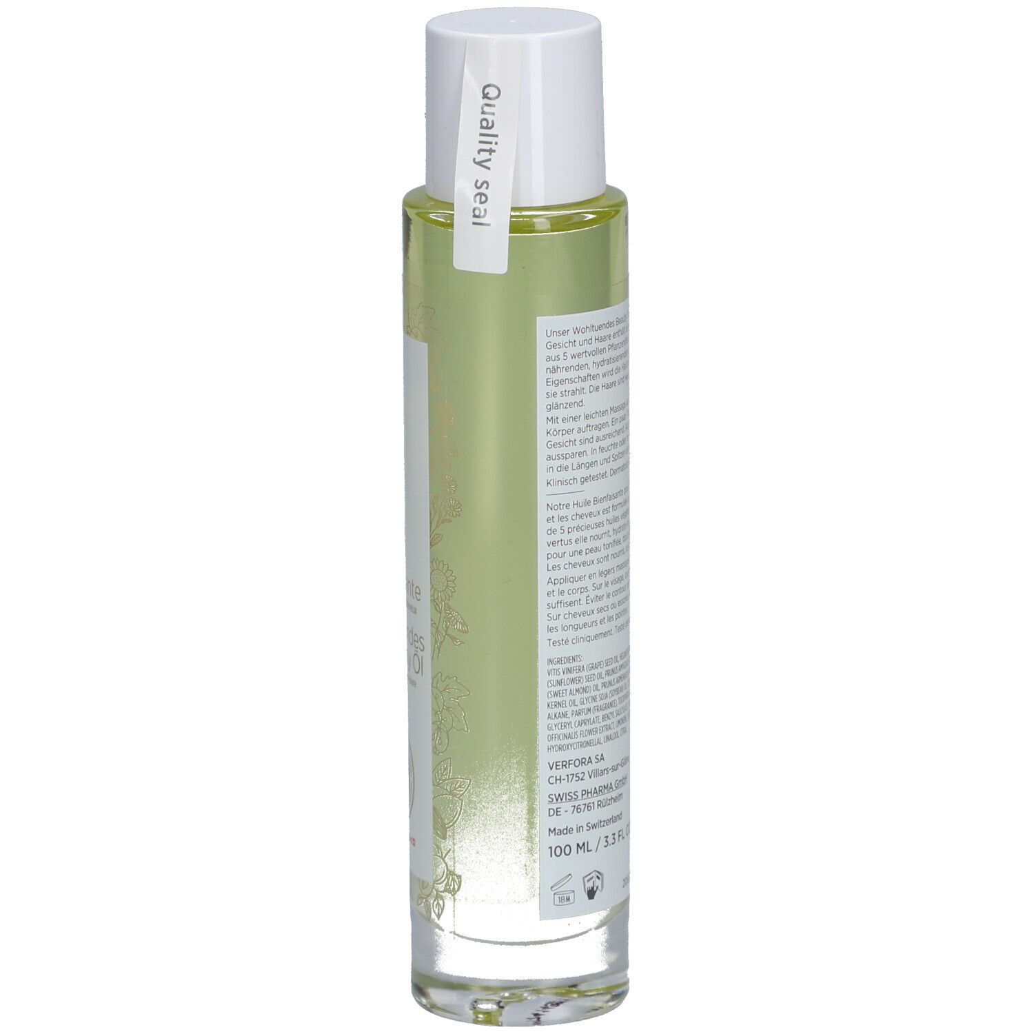 Glazen fles met gelige vloeistof. Witte dop. Etiket met tekst en keurmerk. 100 ml.