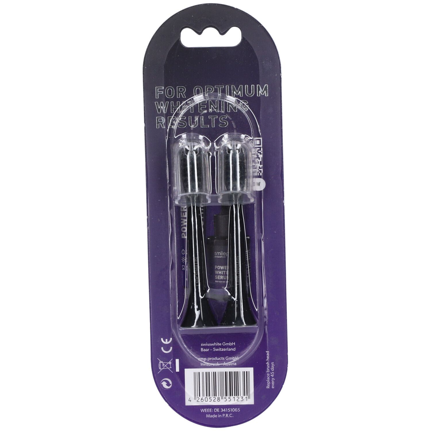 Twee vervangende borstelkoppen in blisterverpakking. Zwarte borstels met transparante houders. Opschrift: "FOR OPTIMUM WHITENING RESULTS".