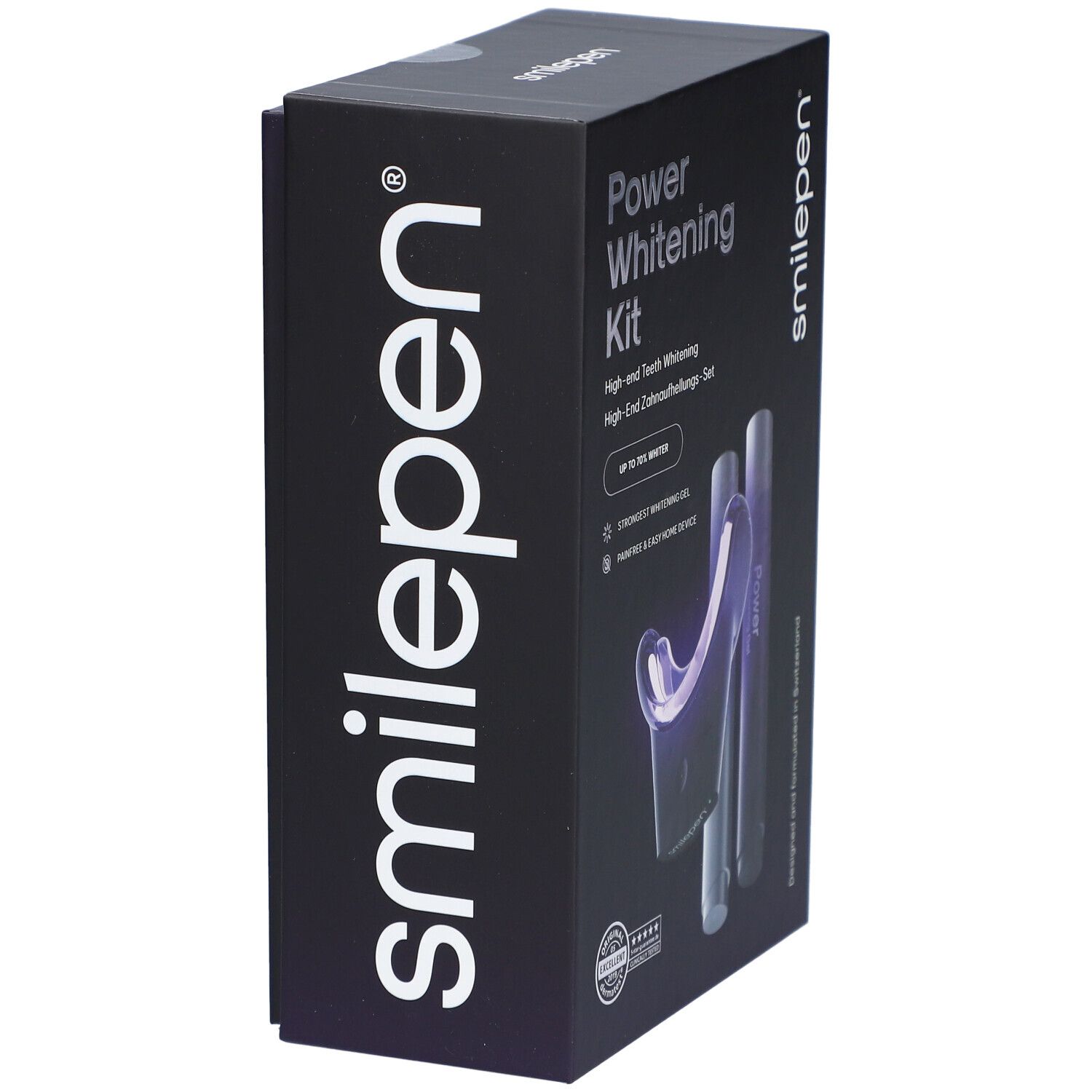 Zwarte doos met "smilepen" logo. "Power Whitening Kit" op de zijkant. Bevat gel en mondstuk.