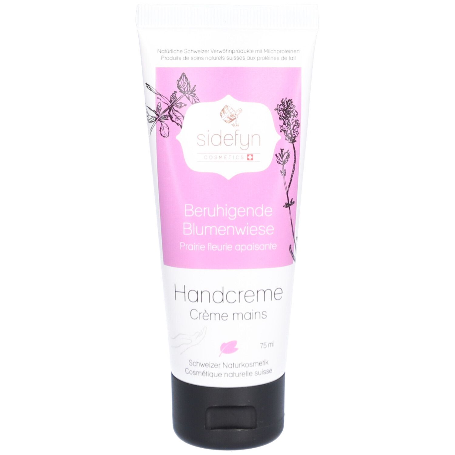 Tube rose avec "Sidefyn Handcreme Beruhigende Blumenwiese". Fermeture noire. Motif floral.