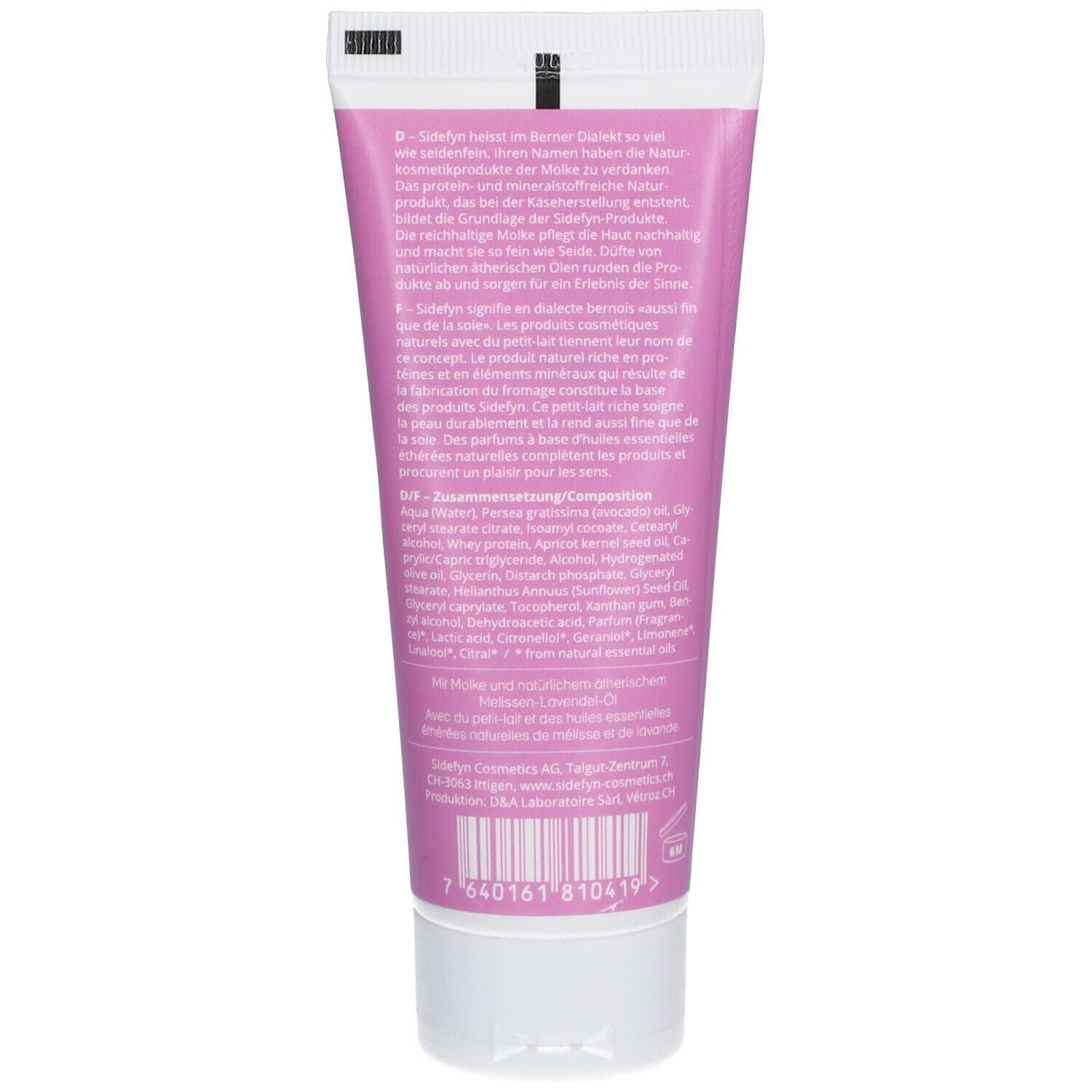 Achterkant van de roze tube. Tekst in het Duits, Frans en Engels. Ingrediënten en barcode.