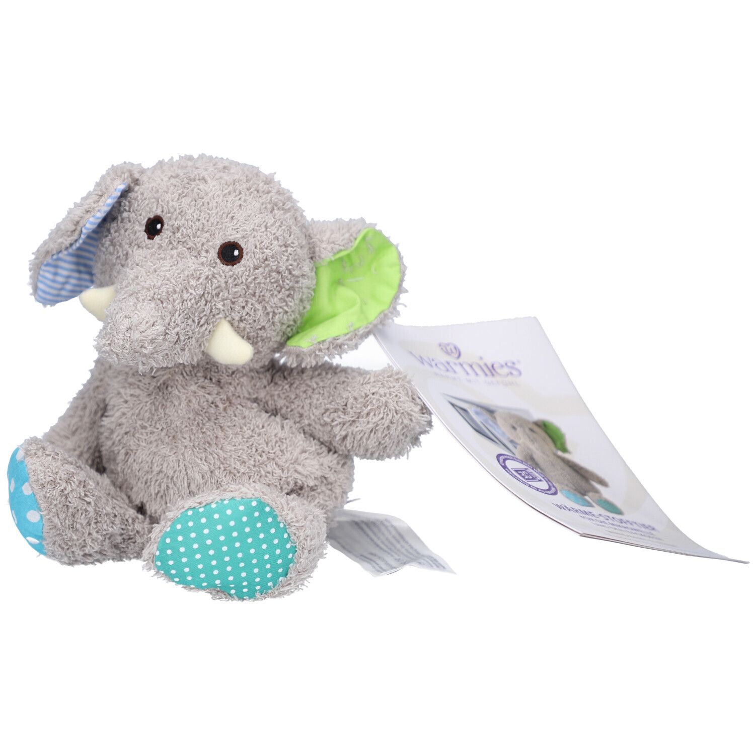 Grijze stoffen olifant met blauwe en groene accenten. Oor met patroon. Label met logo.