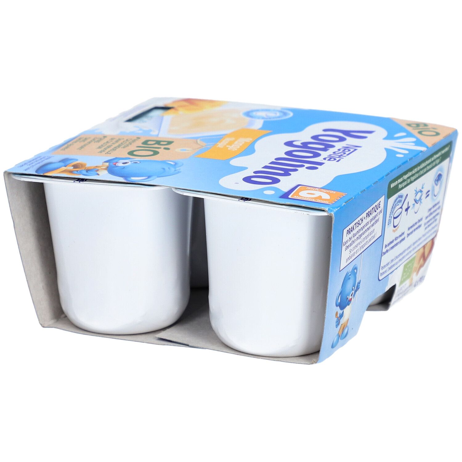 Nestlé Yogolino Bio Mango Kwark, vier witte bekers in een open kartonnen bakje.