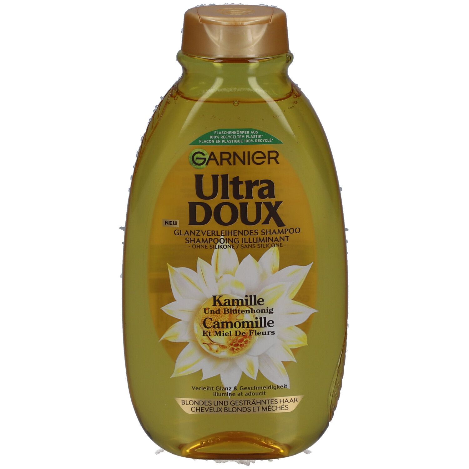 Garnier Ultra Doux shampoo fles. Etiket met kamille en honing. Gouden dop. Tekst: Glansversterkende shampoo.