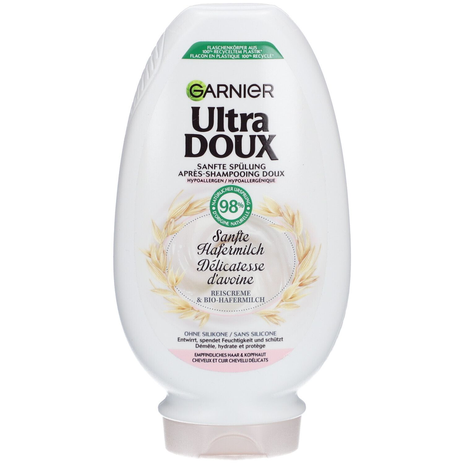 Flacon blanc Garnier Ultra Doux. Étiquette avec nom du produit, illustration lait d'avoine et 98% d'ingrédients naturels.