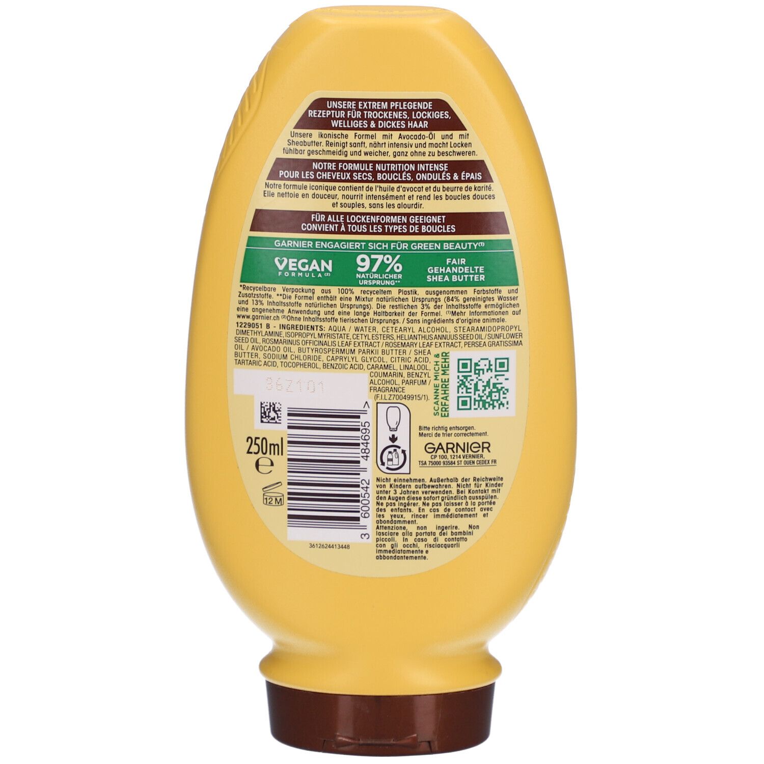 Achterkant gele Garnier Ultra Doux fles. Tekst en QR-code. Vegan logo. 97% ingrediënten van natuurlijke oorsprong. 250ml.