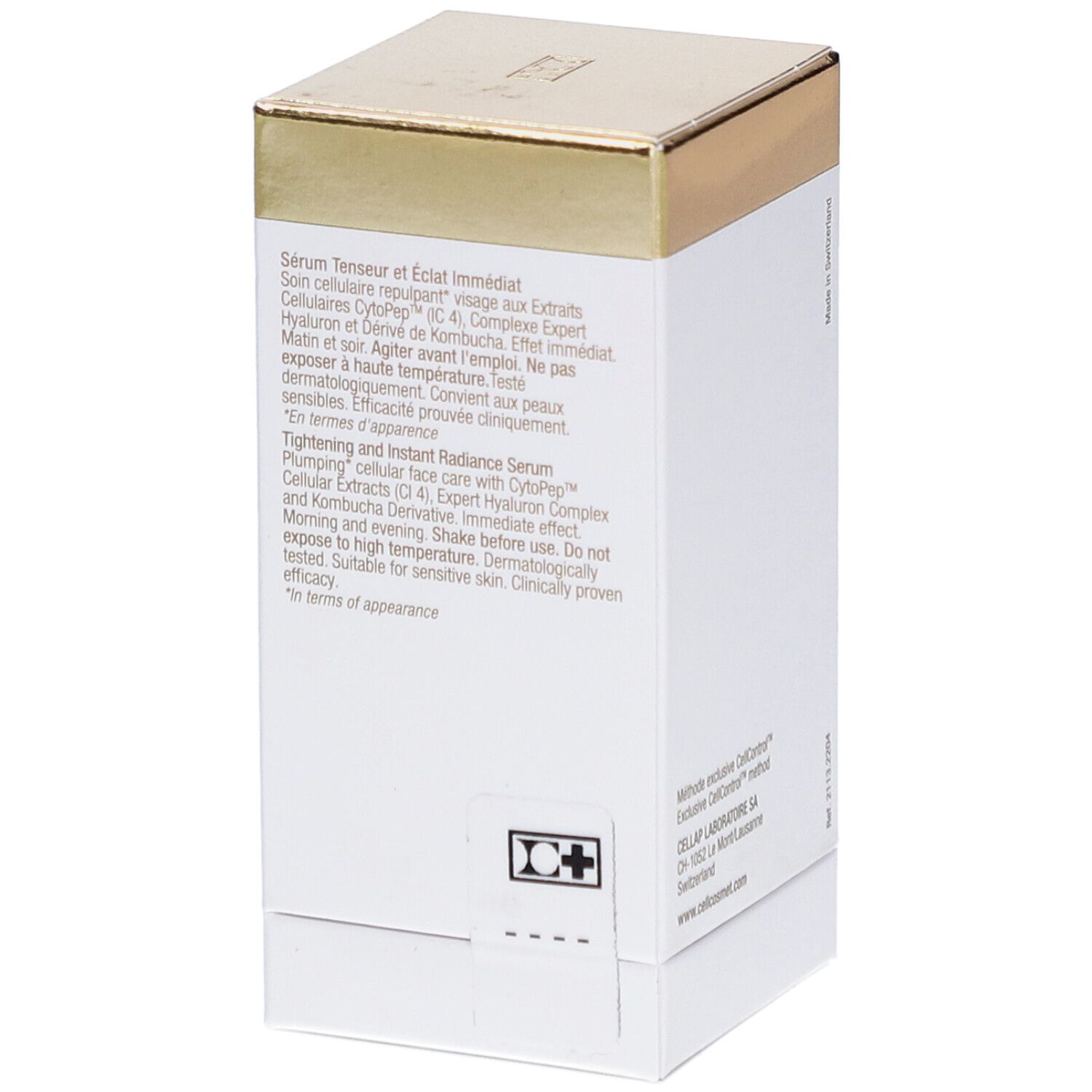 Witte verpakking met gouden deksel. Tekst in het Frans en Engels. Bevat productinformatie.