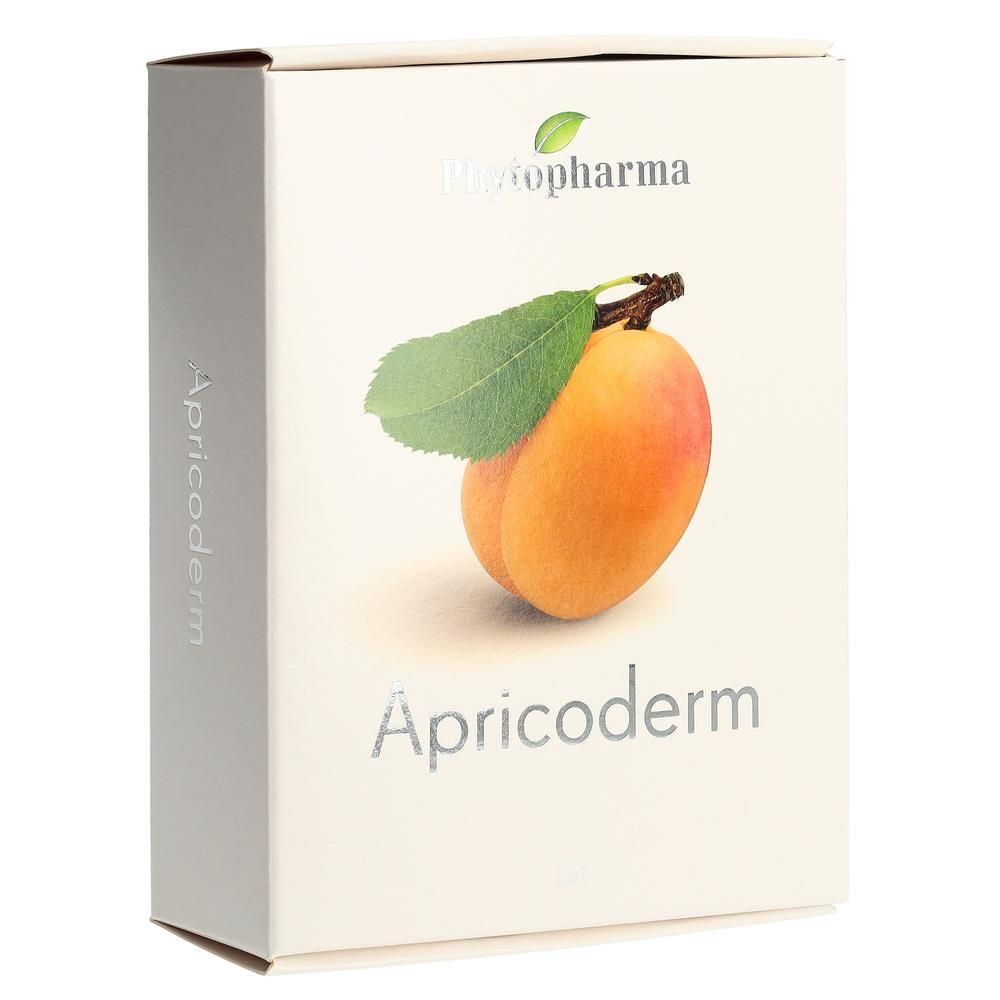 Kartonnen verpakking met Phytopharma logo en afbeelding van abrikoos. Opschrift Apricoderm. Grijze tekst op lichte achtergrond.