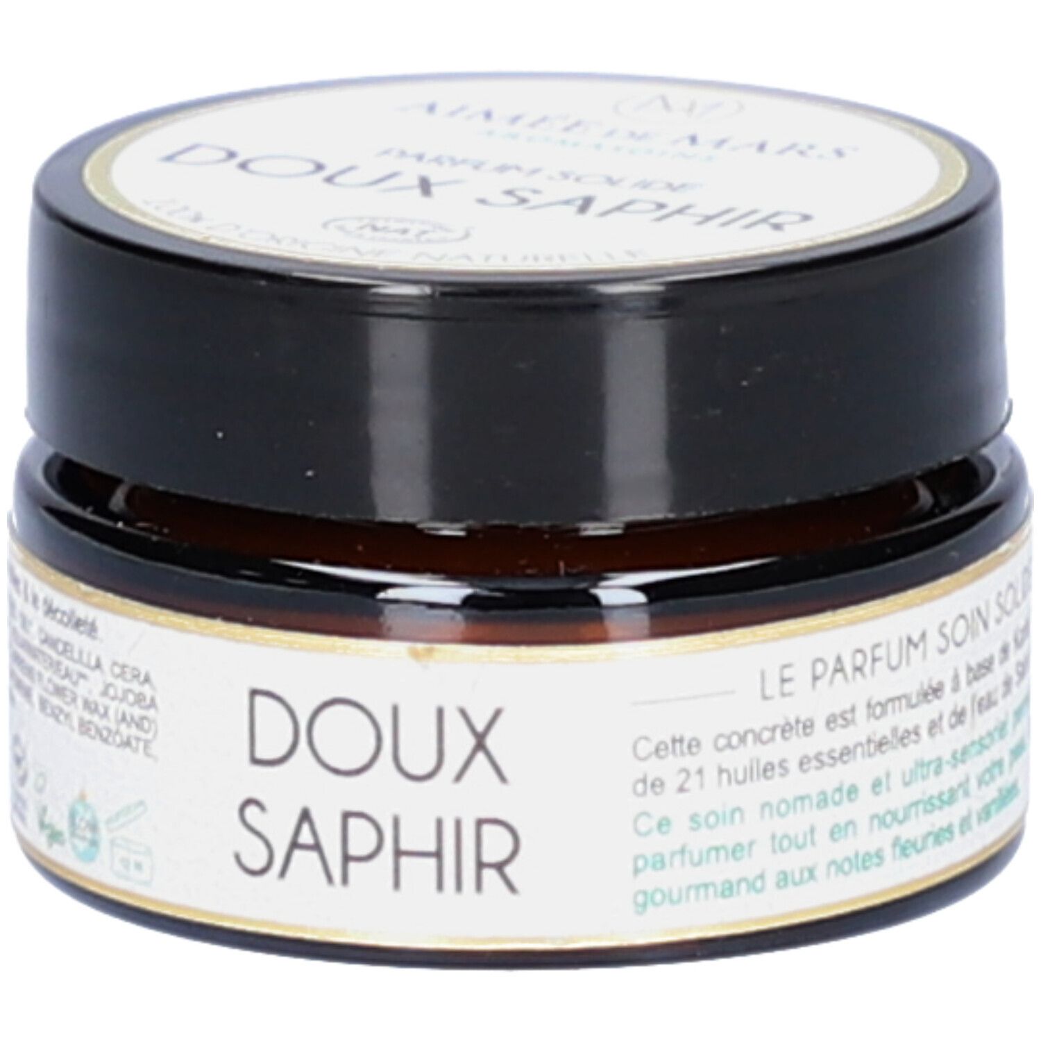 Klein, rond potje met zwarte deksel. Opschrift: Doux Saphir. Productbeschrijving. Vegan-zegel.