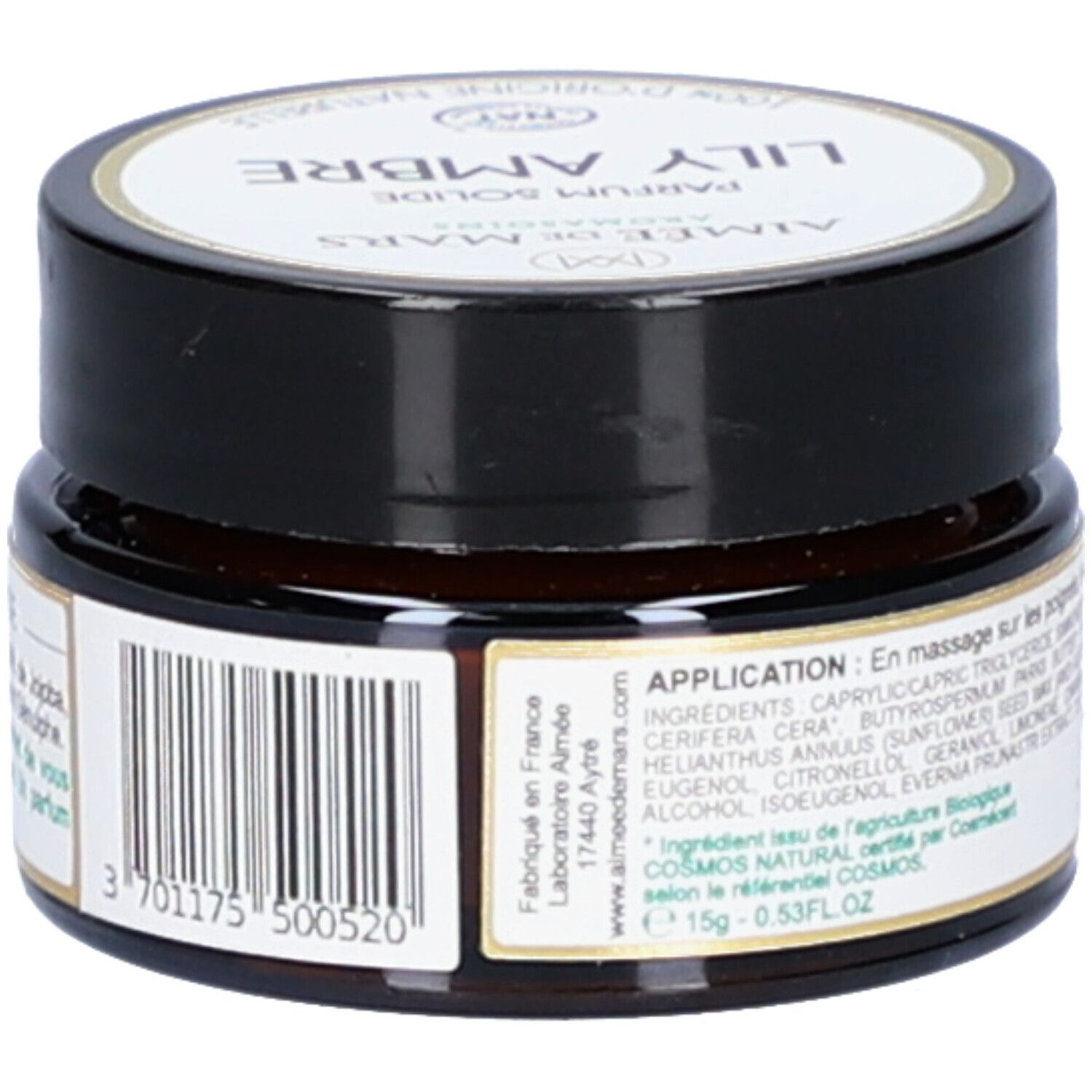 Bruine pot met zwarte deksel. Etiket met barcode en ingrediënten. Opschrift: Lily Ambre Parfum Solide. 15g.