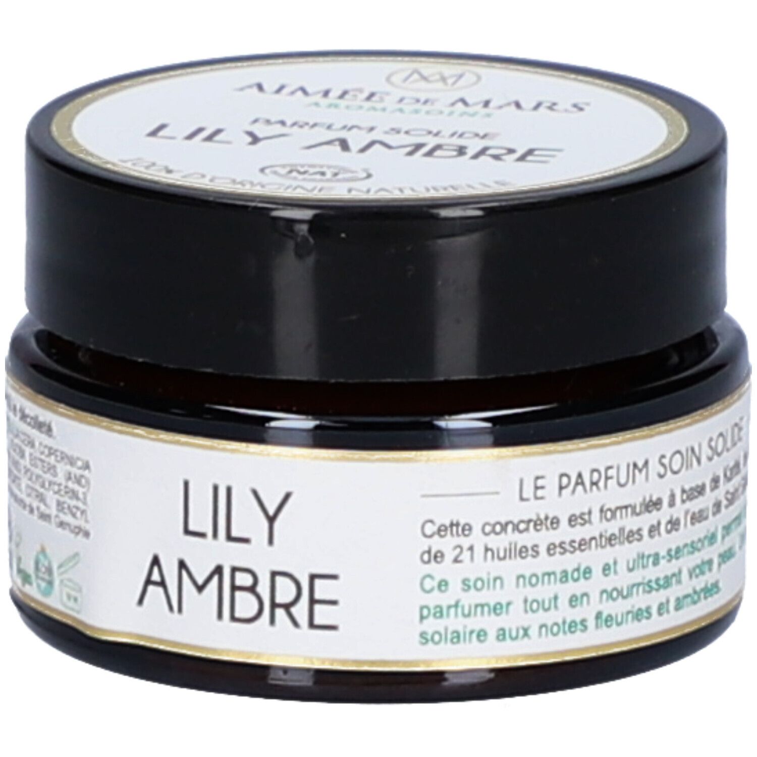 Bruine pot met zwarte deksel. Etiket met productinformatie. Opschrift: Lily Ambre Parfum Solide. 21 essentiële oliën.