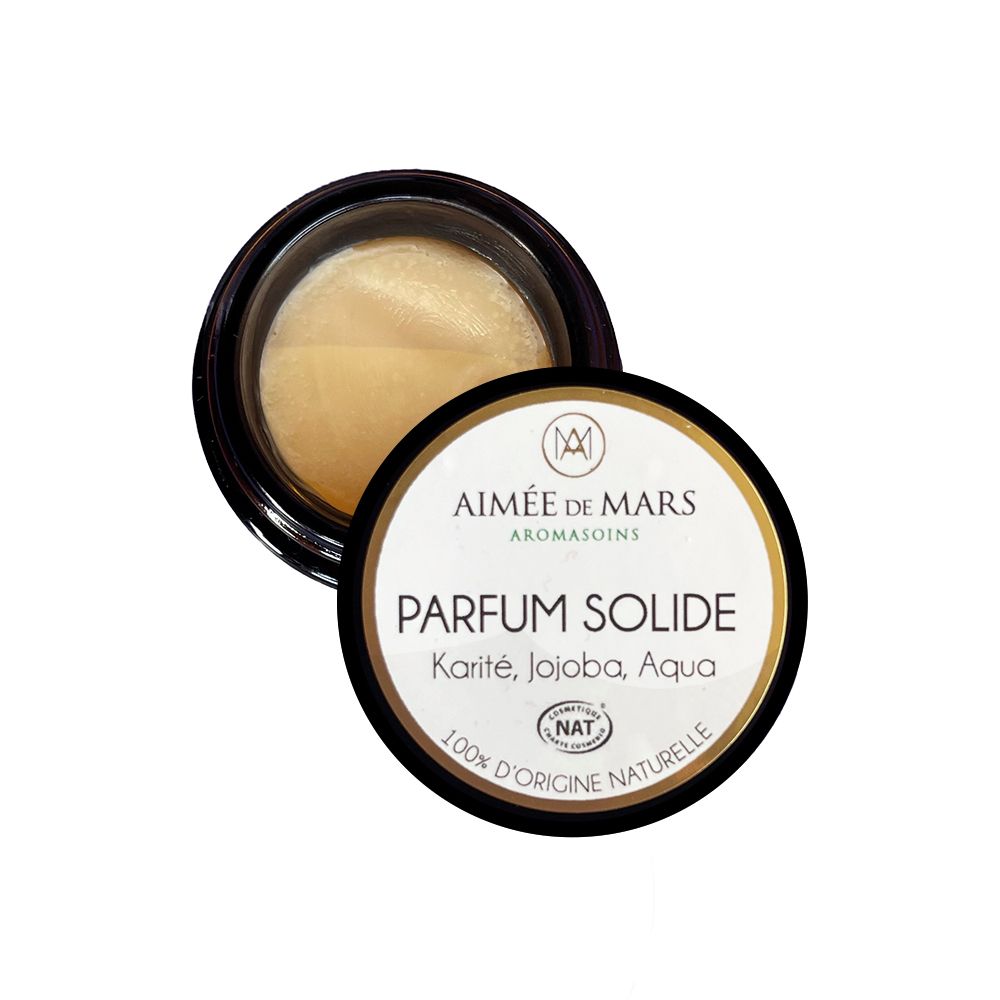 Klein, rond potje met zwarte deksel. Op de deksel staat "PARFUM SOLIDE" en ingrediënten.