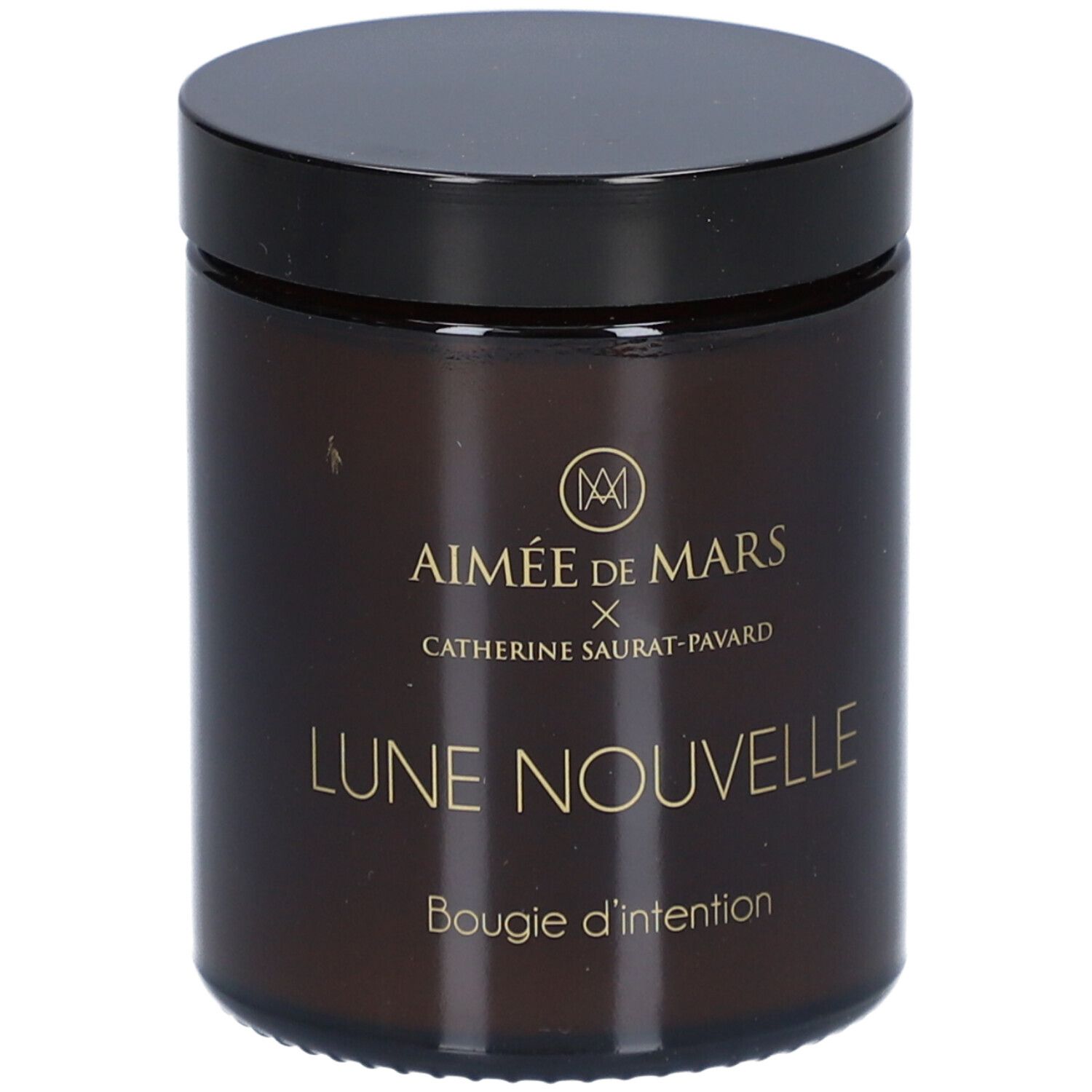 Bruine glazen pot met zwarte deksel. Opschrift: AIMÉE DE MARS x Catherine Saurat-Pavard, Lune Nouvelle, Bougie d'intention.