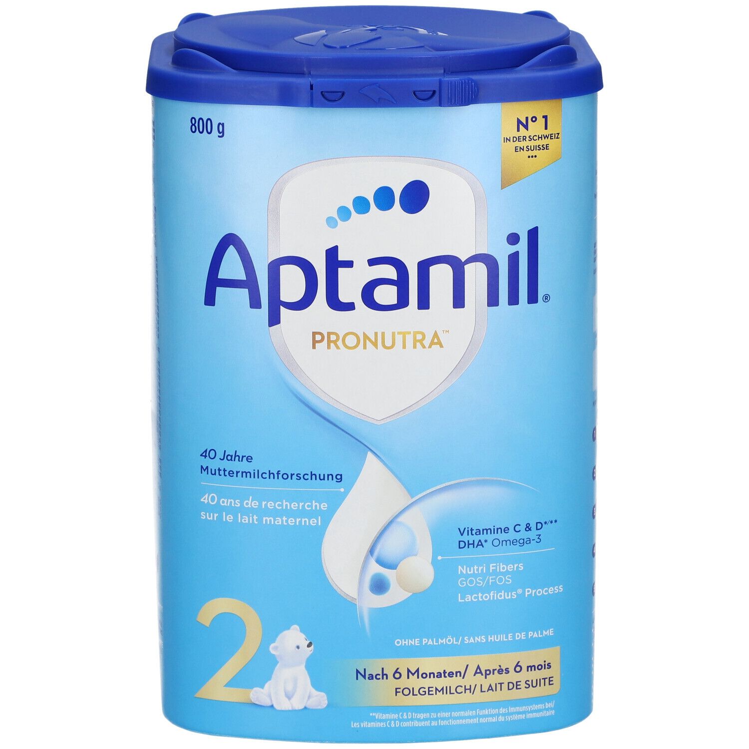 Boîte de lait de suite Aptamil Pronutra 2. Bleue, avec couvercle. 800g. Contient Vitamine C & D, DHA Omega-3. Logo et texte.