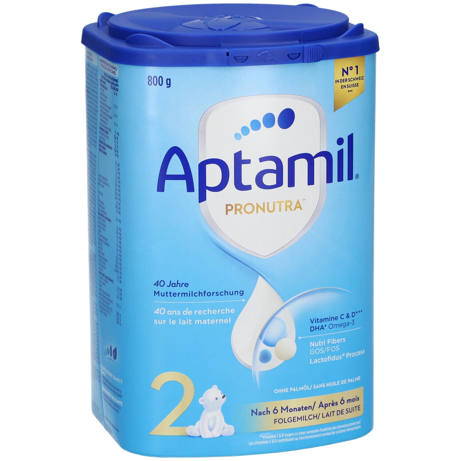 Boîte de lait de suite Aptamil Pronutra 2. Bleue, avec couvercle. 800g. Contient Vitamine C & D, DHA Omega-3. Logo et texte.
