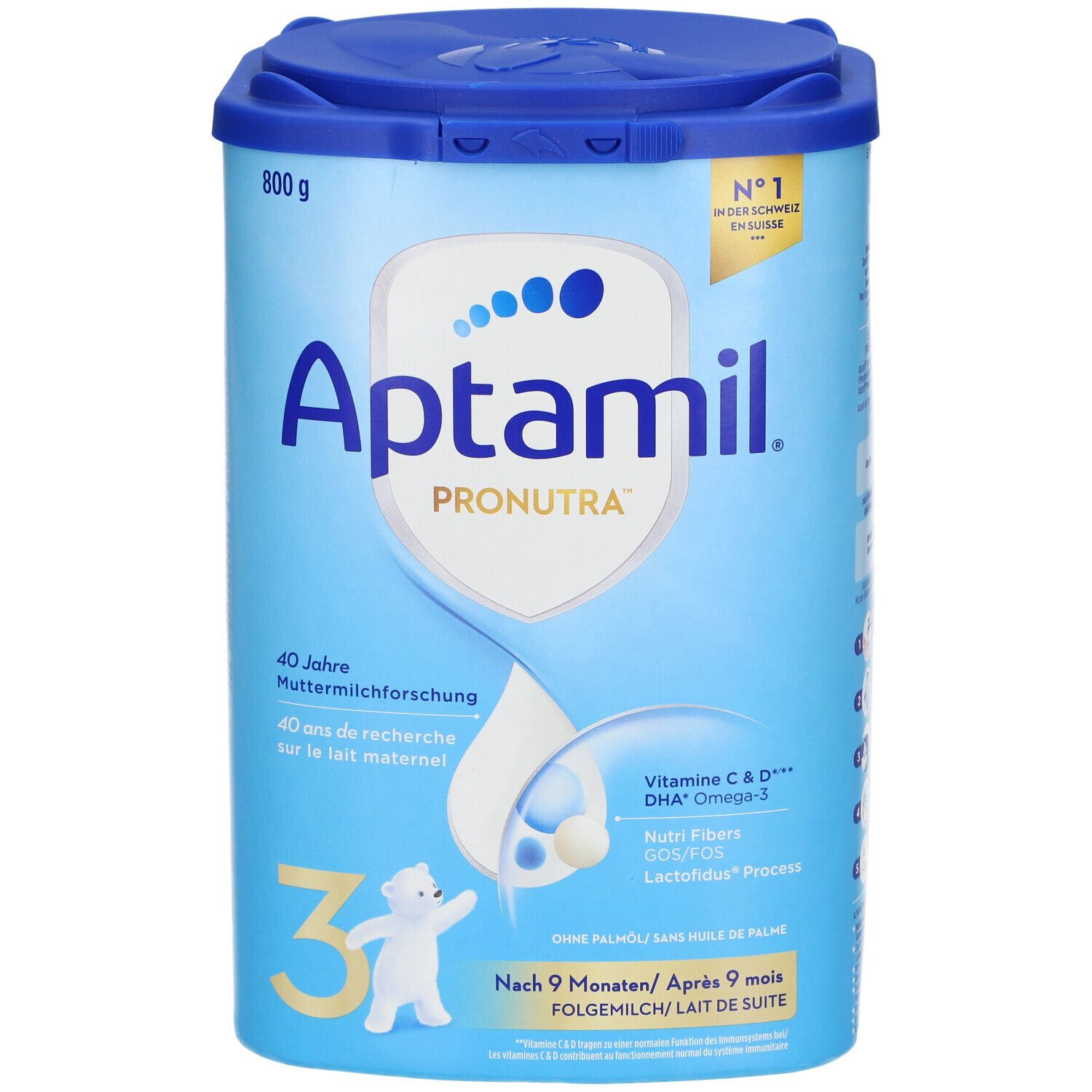 Boîte de lait de suite Aptamil Pronutra 3. Bleu et blanc, avec couvercle. Contient Vitamine C & D, DHA Oméga-3, Nutri Fibers. 800g.