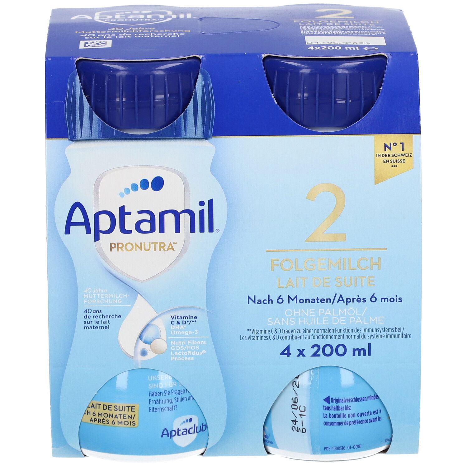 Emballage de quatre bouteilles Aptamil 2 Lait de suite. Bouteilles bleues avec bouchons bleus, dans un emballage en carton. Inscriptions : Aptamil, 2, Lait de suite.