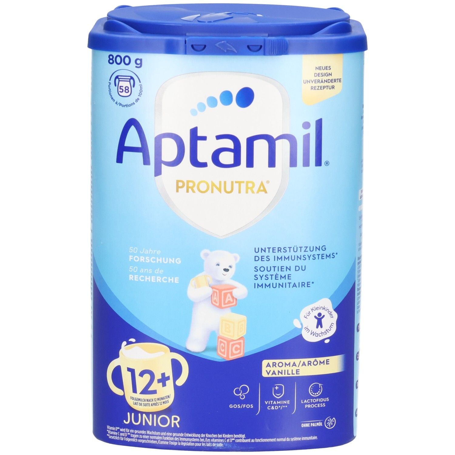 Aptamil Pronutra Junior 12+ Vanille. Boîte bleue avec couvercle. Contient 800g. Inscriptions: Vitamine C, Vitamine D, Nutri Fibers, Lactofidus Process.