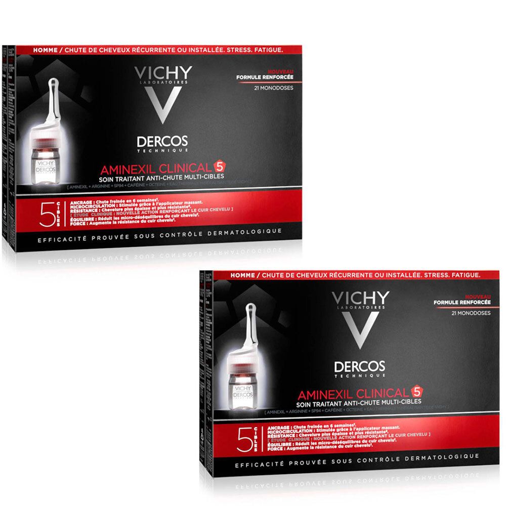 Deux boîtes de Vichy Dercos Aminexil Clinical 5. Boîtes noires avec texte rouge. Visible : ampoule, logo, nom du produit et texte.