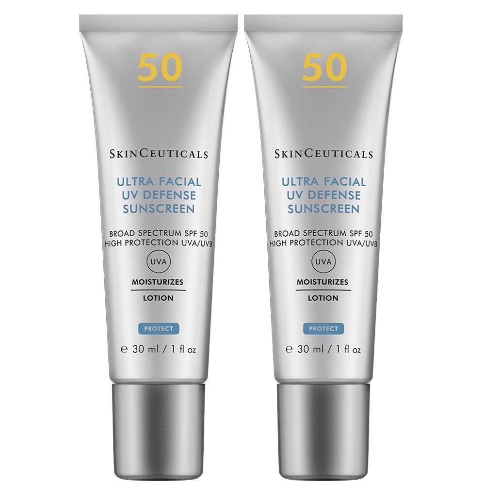 Deux tubes de SkinCeuticals Ultra Facial UV Defense Sunscreen SPF 50. Tubes blancs avec bouchons gris. Texte : UVA, Lotion, 30 ml.