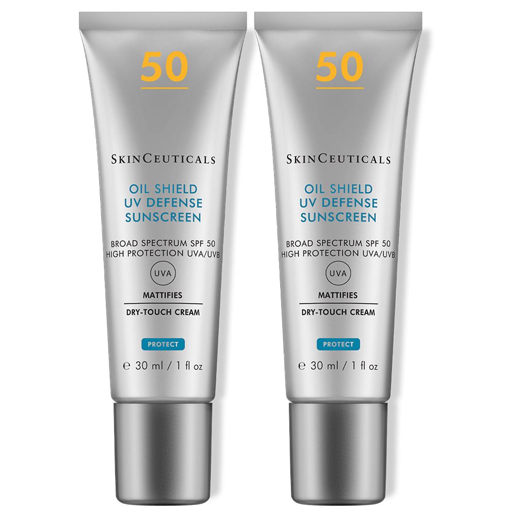 Deux tubes de crème solaire. Inscription : SkinCeuticals, Oil Shield UV Defense Sunscreen, SPF 50. Tube gris avec bouchon argenté.