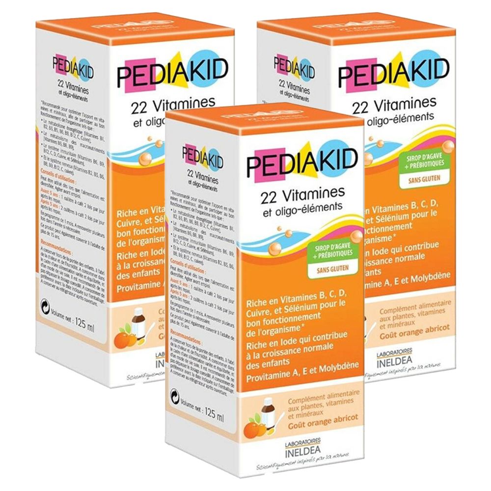 Meerdere verpakkingen van PEDIAKID® 22 Vitaminen en sporenelementen. Oranje-witte dozen met productinfo en logo.