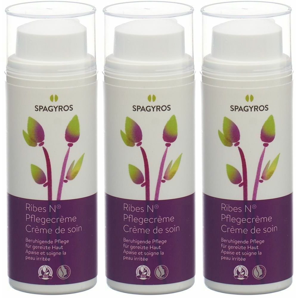 Trois flacons distributeurs blancs avec couvercles transparents. Inscription: SPAGYROS, Ribes N Pflegecrème. Motif floral violet-vert.