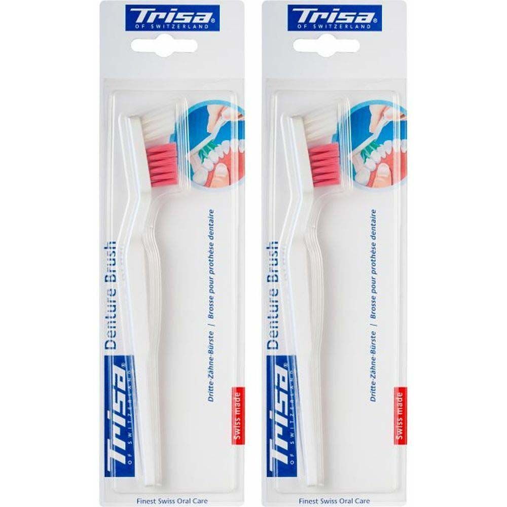 Deux brosses à prothèses Trisa en emballage blister. Manches blancs, soies roses. Inscription : Denture Brush, Trisa.