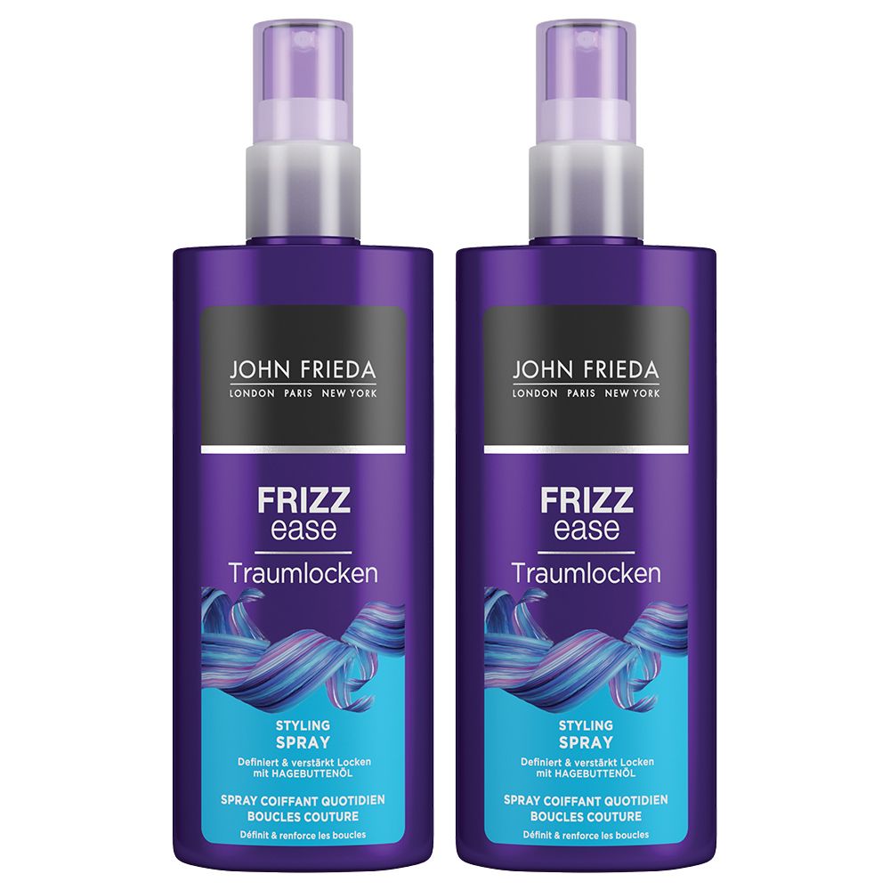 Twee paarse flessen JOHN FRIEDA Frizz Ease Traumlocken Styling Spray. Met sproeikop en productnamen.