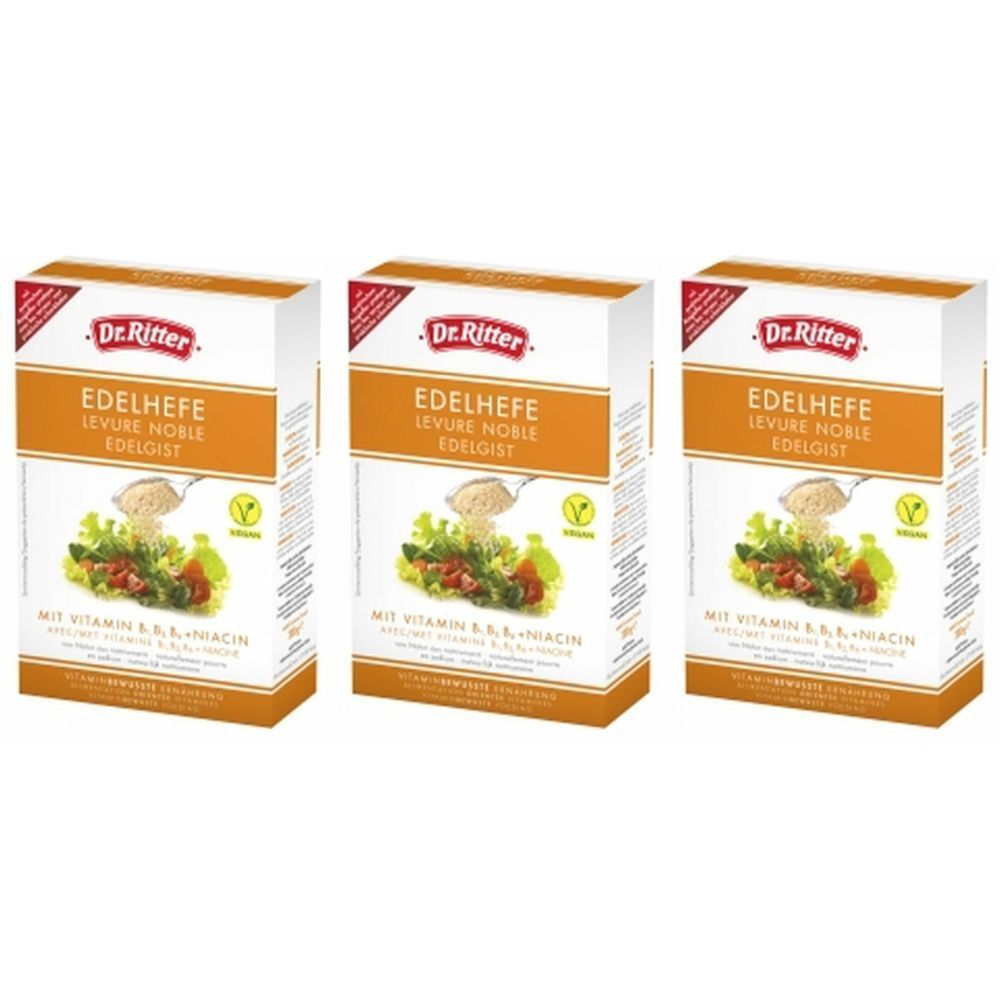 Trois boîtes de flocons de levure DR. Ritter Edelhefe. Emballage blanc et orange avec nom, image et label vegan.
