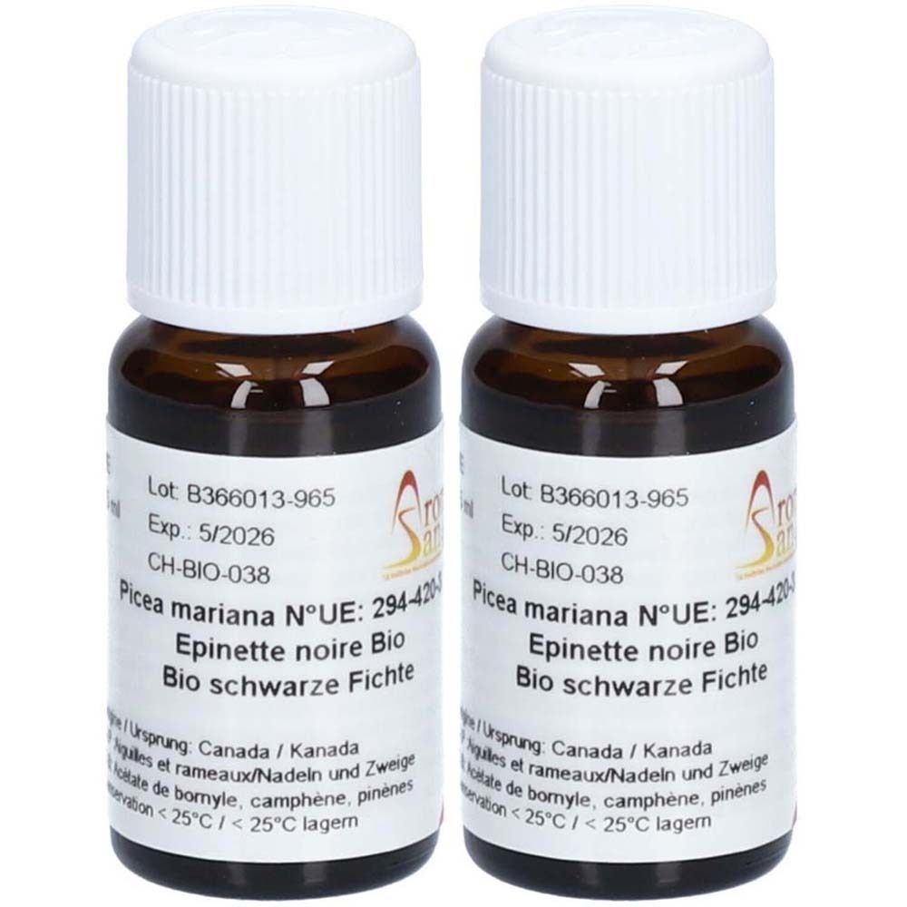 Twee kleine bruine glazen flesjes met witte doppen. Labels met tekst: Picea mariana, Epinette noire Bio, Bio schwarze Fichte.