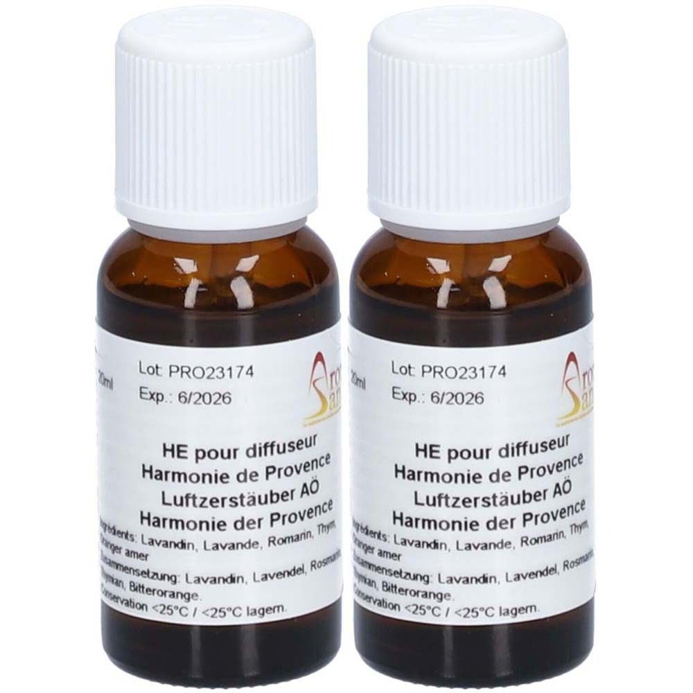 Twee bruine glazen flessen met witte doppen. Labels met tekst: "HE pour diffuseur Harmonie de Provence".