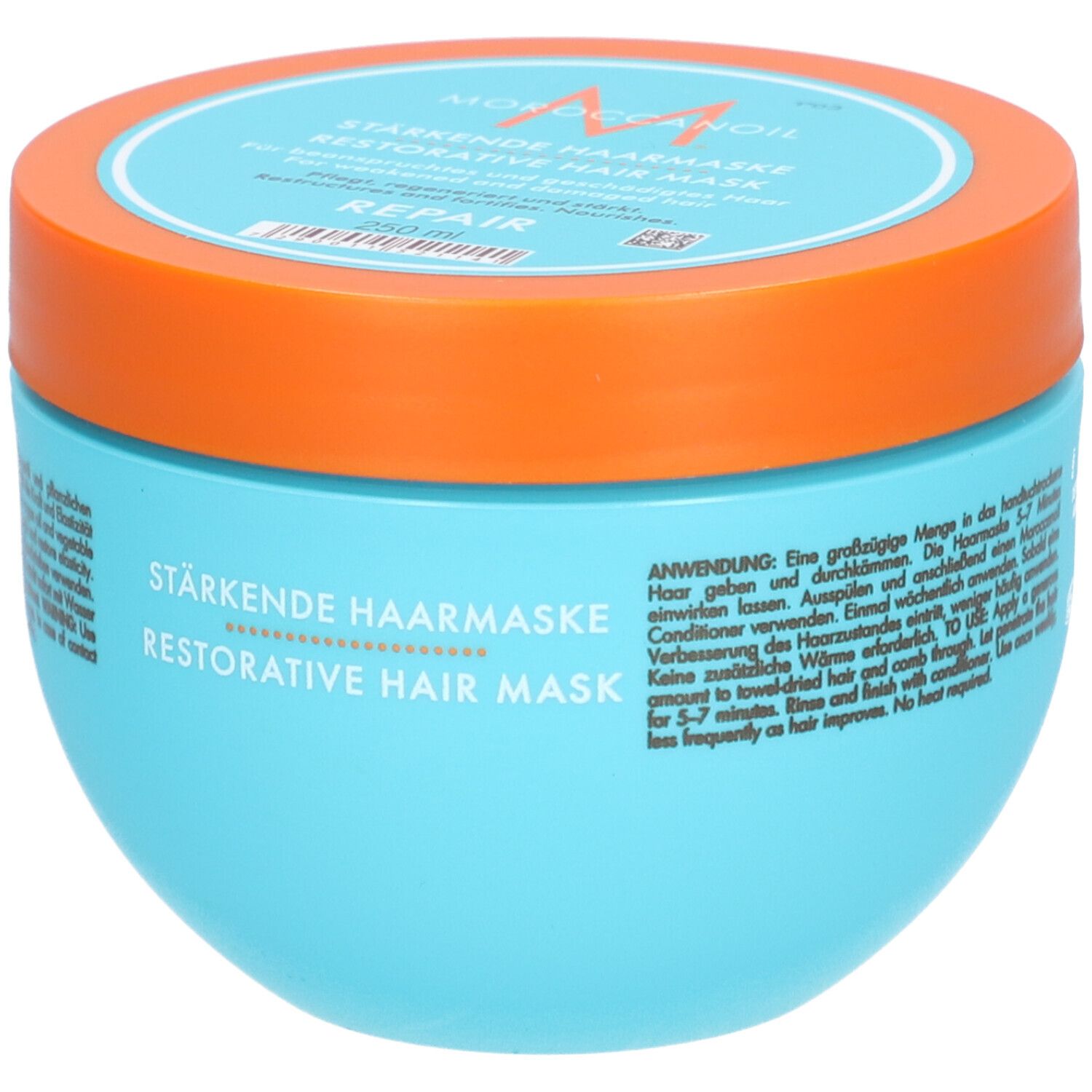 Pot bleu turquoise avec couvercle orange. Inscription : Masque capillaire réparateur. Mode d'emploi.