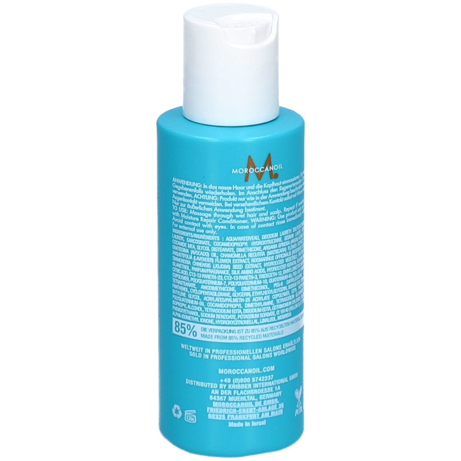 Achterkant van een turquoise shampoo fles met witte dop. Meertalige tekst, 85% gerecycled materiaal, vegan logo.