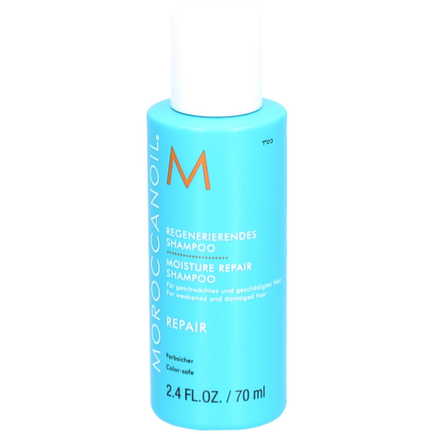 Turquoise shampoo fles met witte dop. Opschrift: Moroccanoil, Regenererendes Shampoo, Moisture Repair Shampoo.