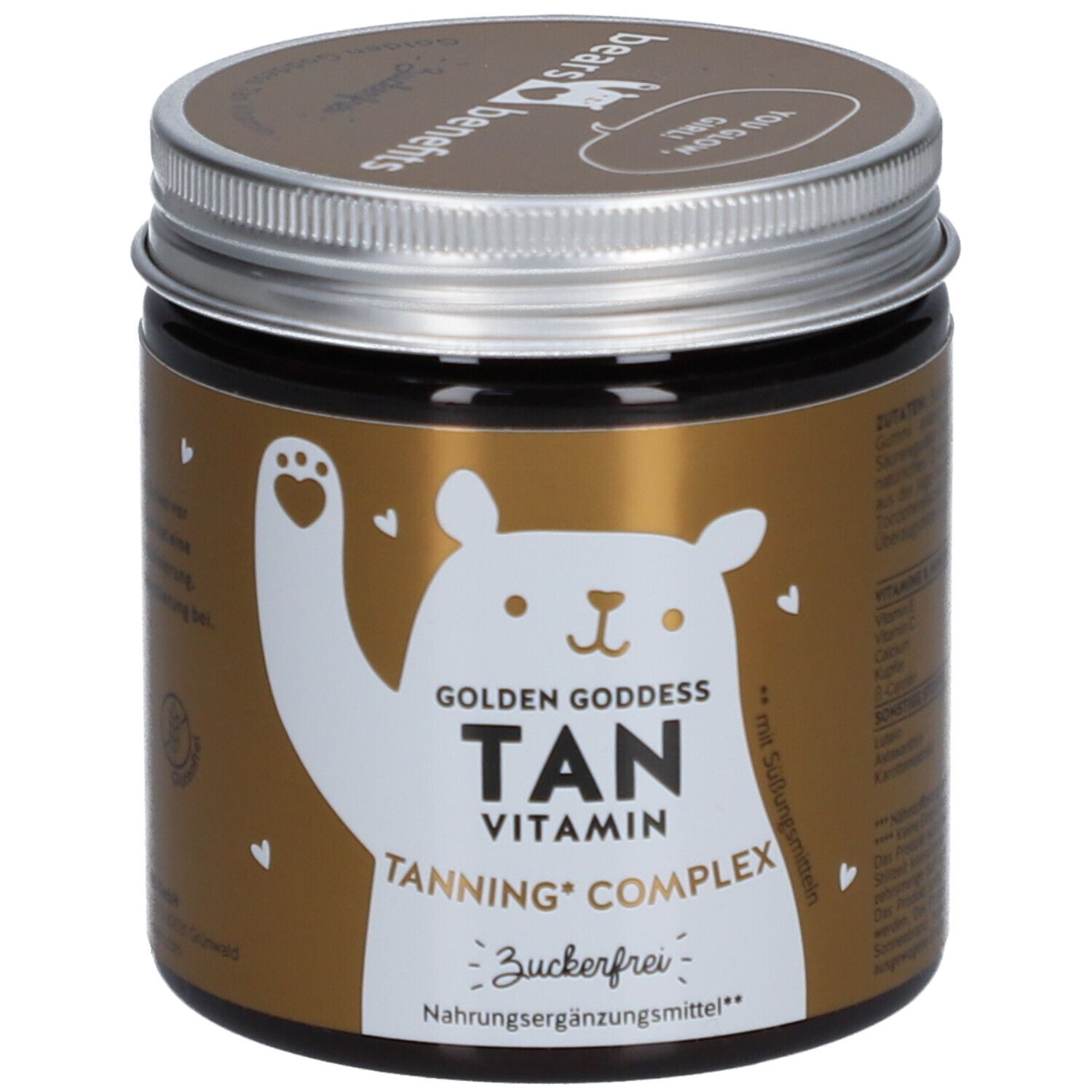 Pot brun avec couvercle argenté. Inscription : Golden Goddess Tan Vitamin, Tanning Complex, sans sucre. Logo ours.