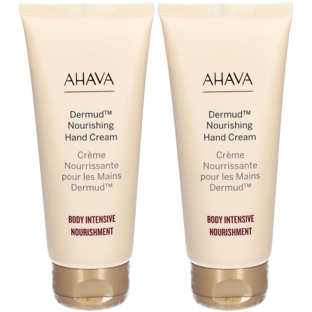 Twee tubes AHAVA Dermud handcrème. Beige tubes met bruine tekst. Productnaam en tekst duidelijk zichtbaar.