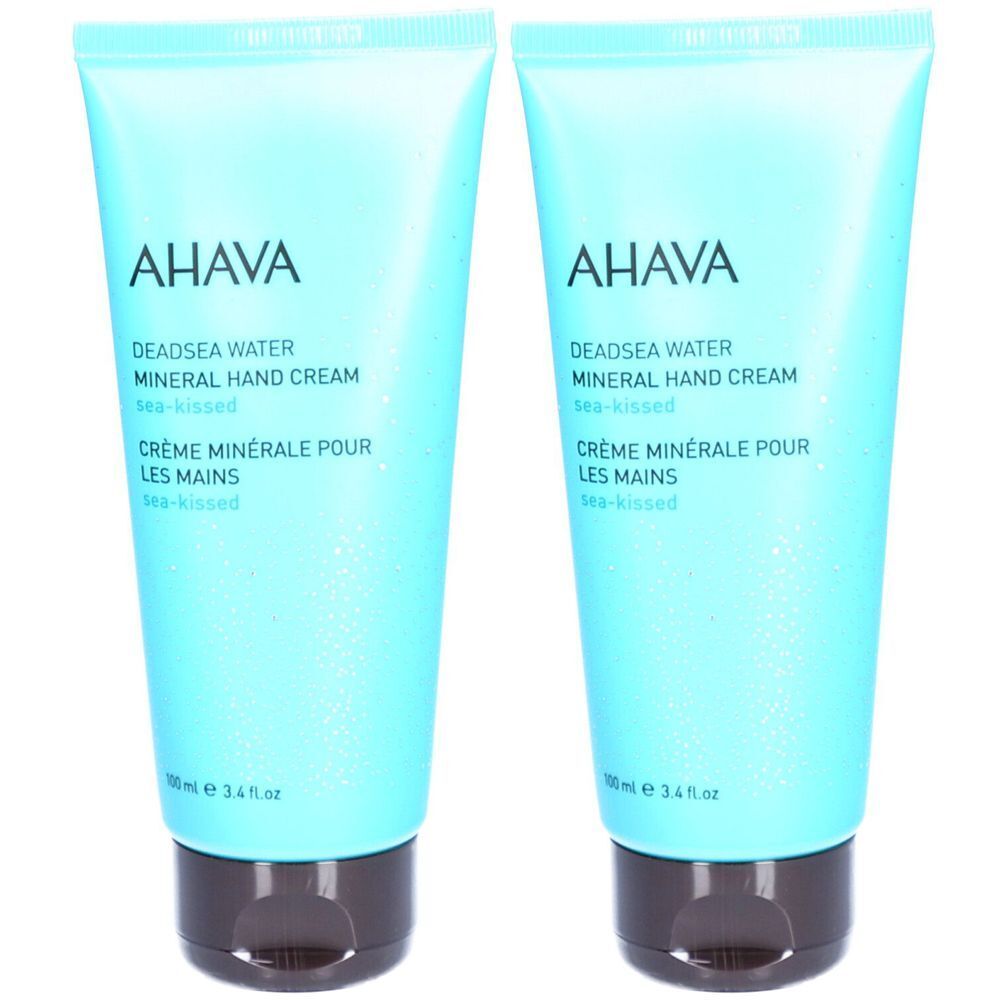 Twee lichtblauwe handcrèmetubes met AHAVA-opschrift en productbeschrijving. Bruine sluiting.