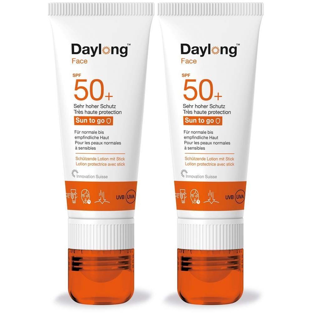 Deux tubes de lotion solaire Daylong Face SPF 50+. Tubes blancs avec base orange. Texte : Très haute protection, Sun to go.
