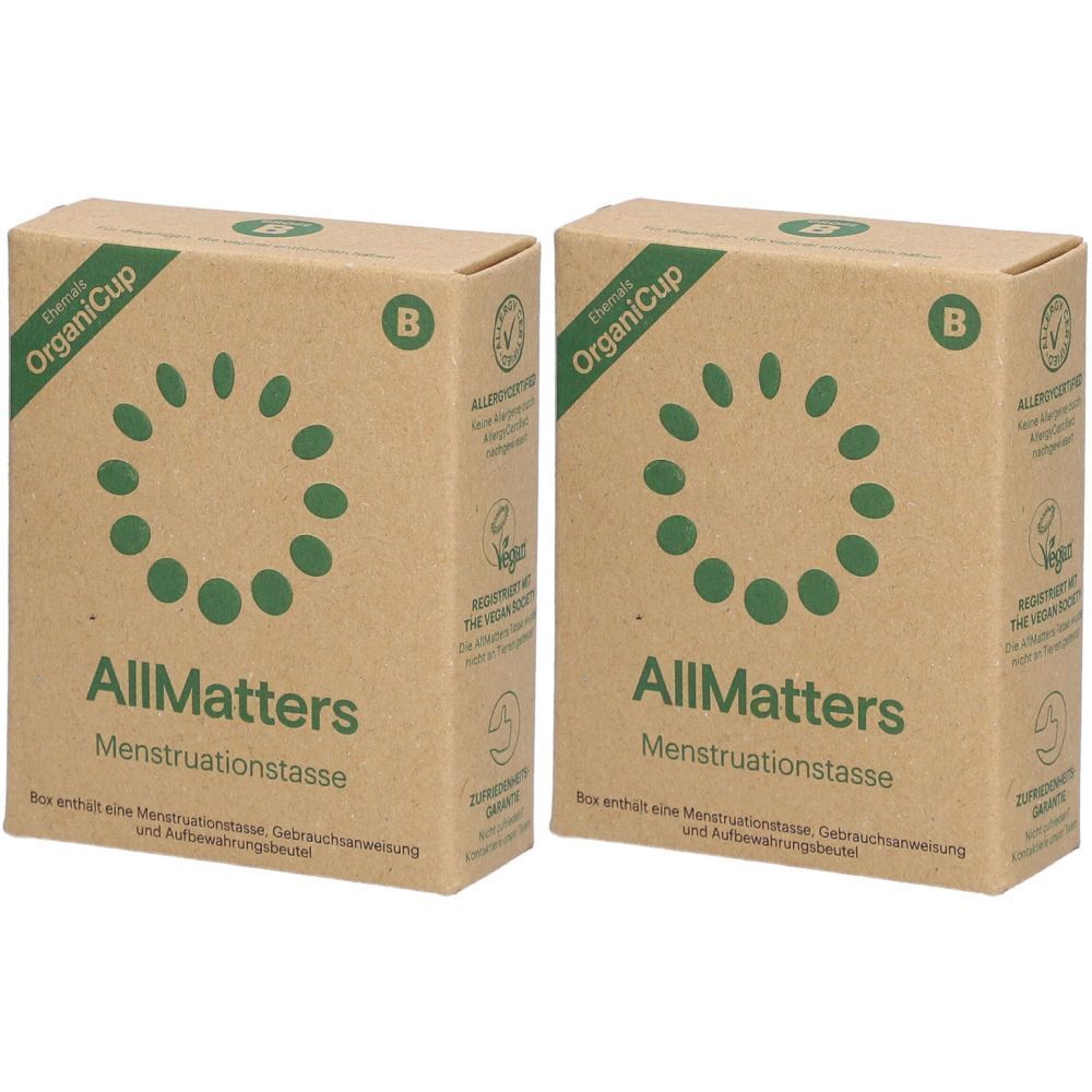 Twee rechthoekige dozen. Opschrift "OrganiCup", "AllMatters Menstruationstasse". Vegan-zegel.