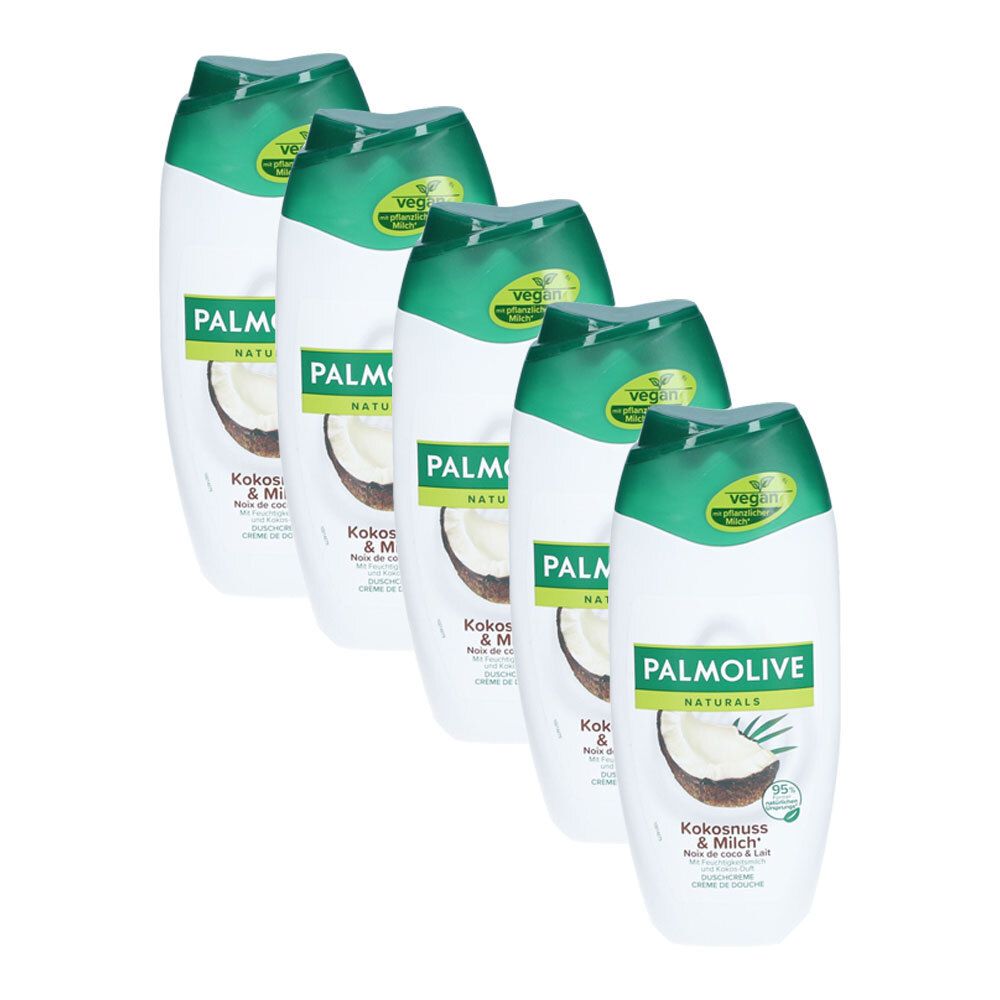 Zes witte douchecrèmeflessen met groene doppen. Opschrift: PALMOLIVE Naturals Kokosnoot & Melk. Vegan-zegel.