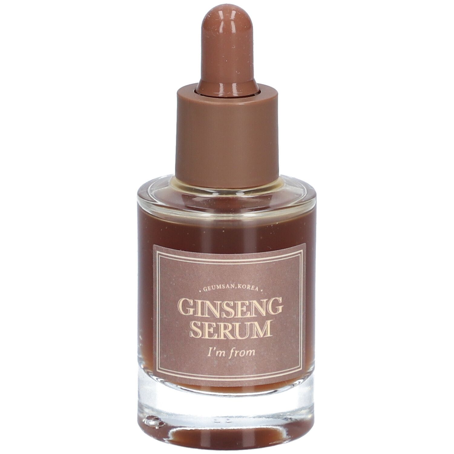 Glazen fles met bruine vloeistof en bruine dop. Op het etiket staat "Ginseng Serum" en "I'm from".
