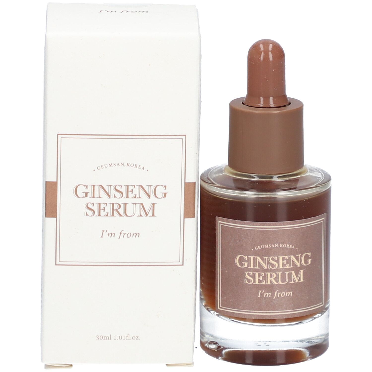 Glazen fles met bruine vloeistof en bruine dop, naast een witte doos. Op de fles staat "Ginseng Serum".