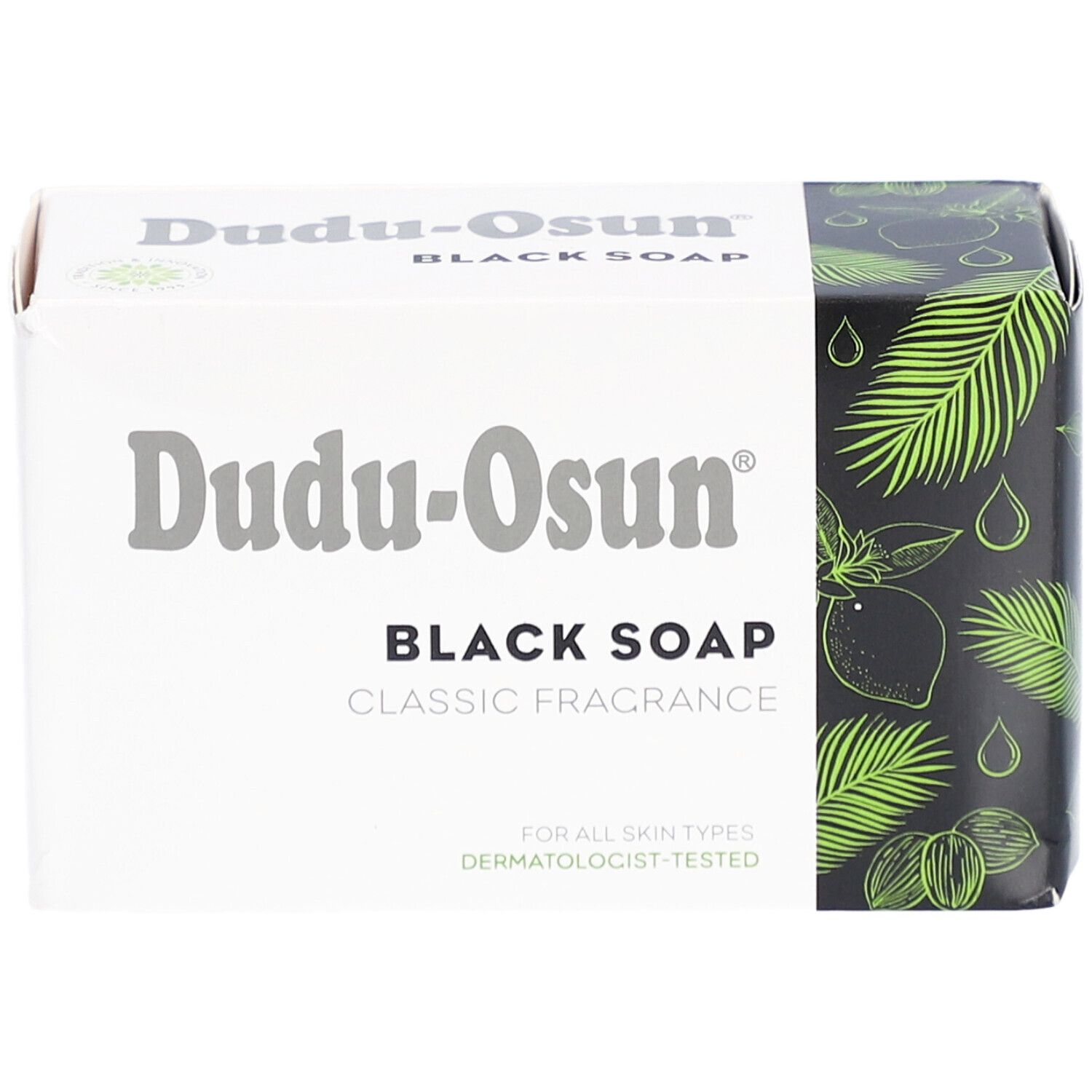 Emballage de savon noir Dudu-Osun. Boîte blanche avec nom et logo du produit. Côté noir avec motifs végétaux.